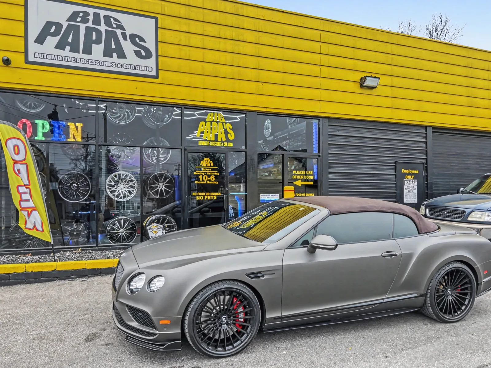 Bentley at Big Papa's storefront on custom wheels