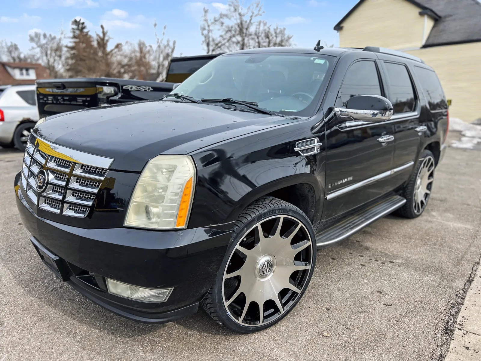 Black Escalade on oversized custom wheels